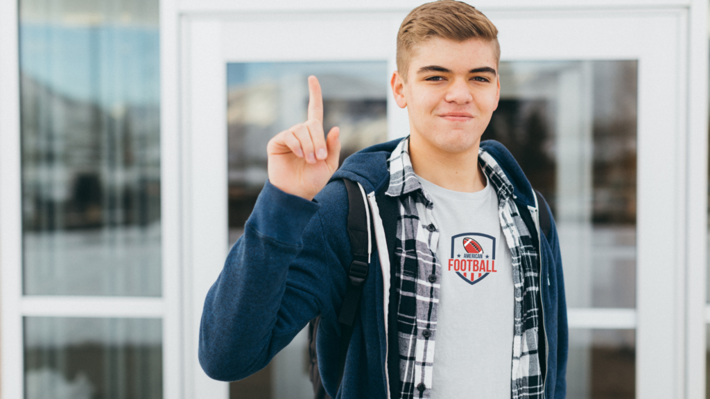 Teenager wearing gray custom football t-shirt